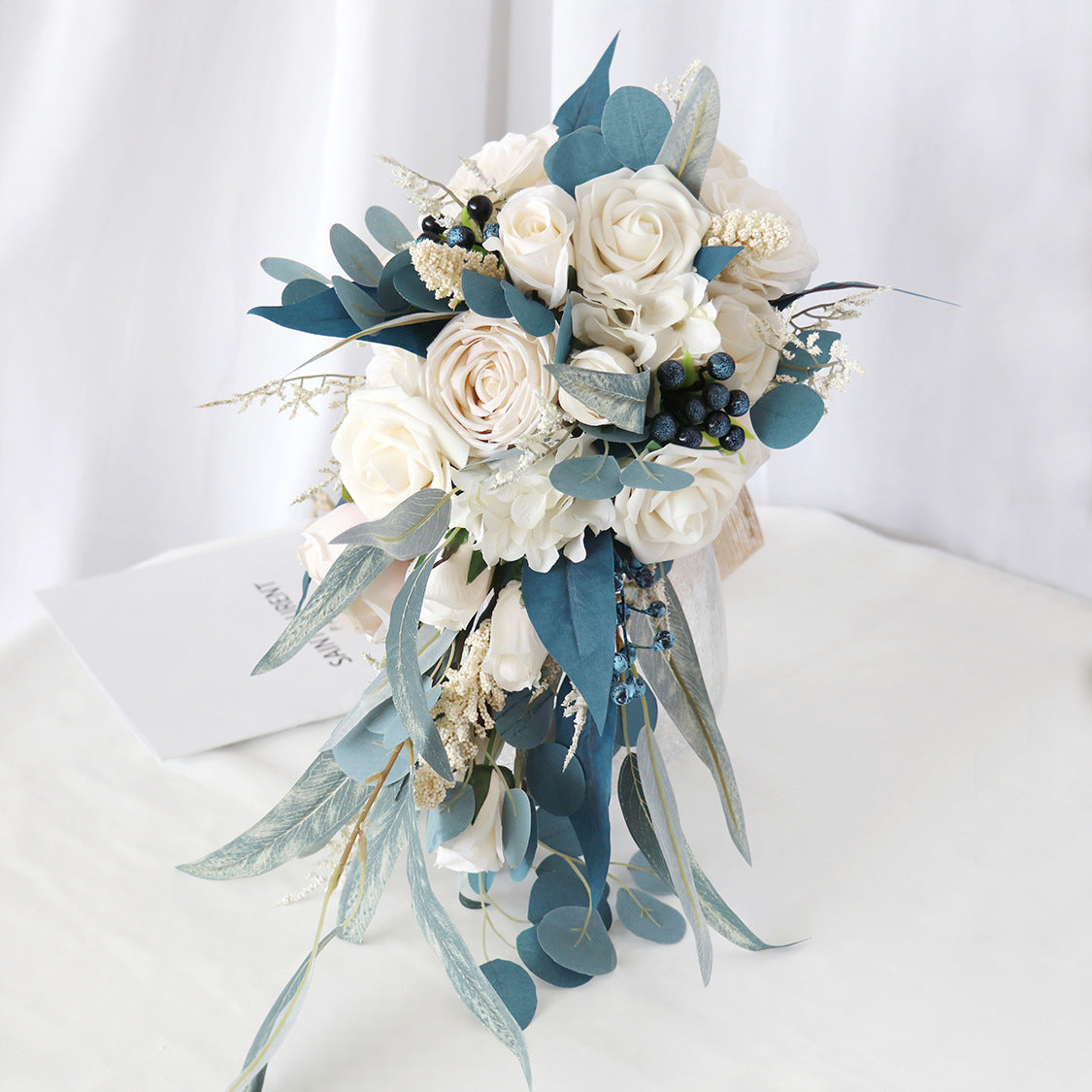 Hand Bouquet Peacock Blue Champagne Roses