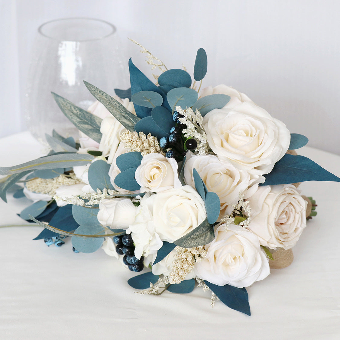 Hand Bouquet Peacock Blue Champagne Roses